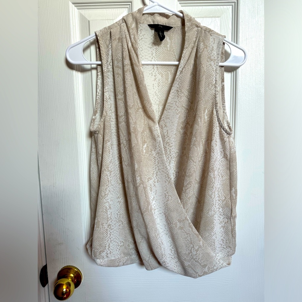 Super cute top ,nude color with snake skin print design,will fit anyone style😉